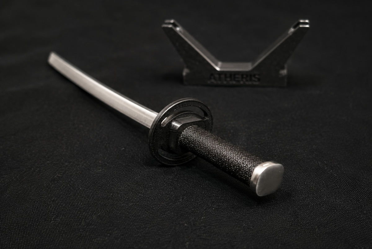 Shiranui katana miniature with black handle on a black background